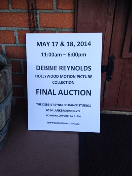 Sign for Debbie Reynolds' auction of Hollywood memorabilia. Reynolds had hoped the Motion Picture Academy would buy her collection.