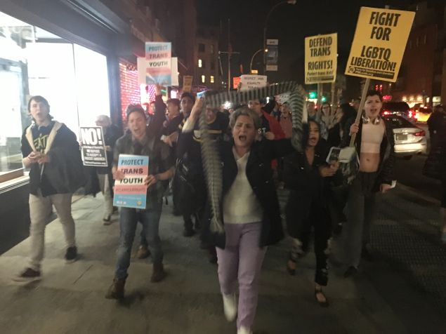 Rally participants marching in support of transgender students.
