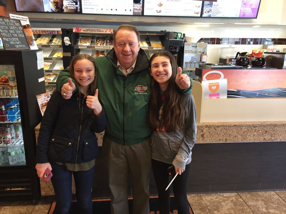 Dick Codey greets two future voters at a Dunkin' Donuts in West Orange.