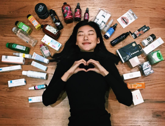 Model Jessie Li Wang posing with her favorite beauty products