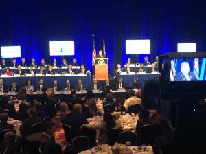 Christie delivers his speech flanked by N.J. senators and members of congress.