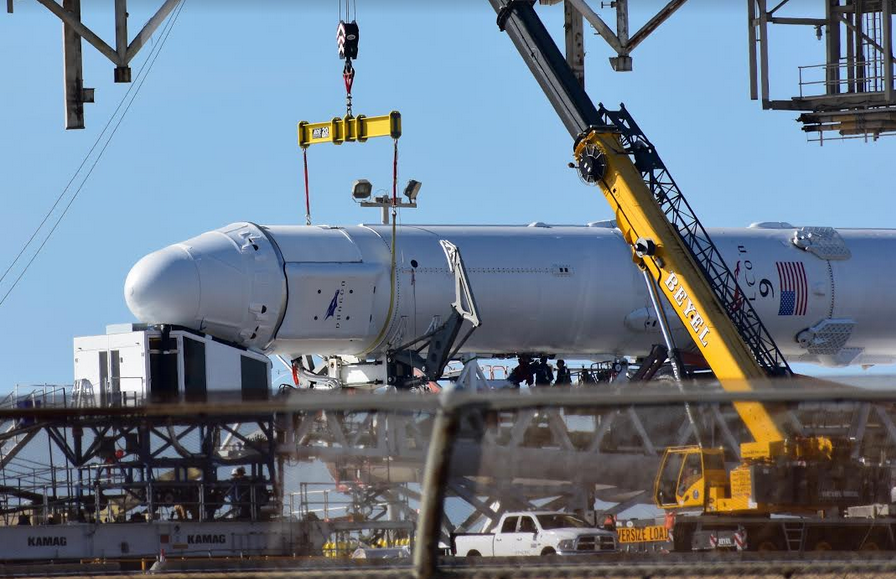 The SpaceX Dragon mated to a Falcon 9 rocket at Launch Complex 39A.