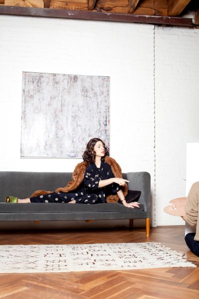 Tomei lounges in Suzanne Rae.