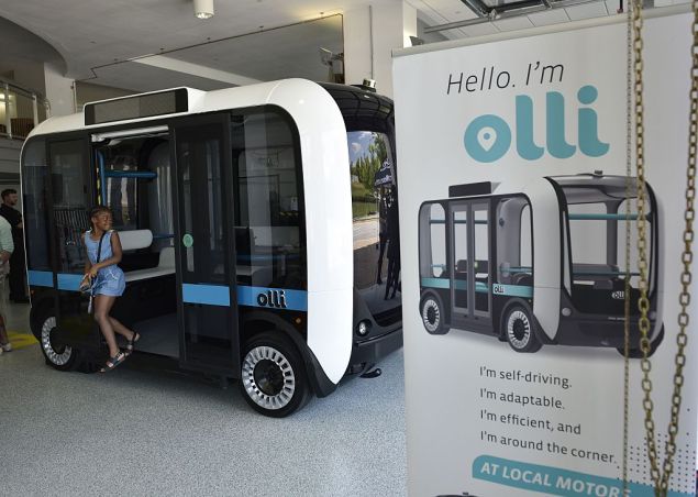 'Olli' an autonomous shuttle is seen at the Local Motors facility at the National Harbor in Maryland on June 16, 2016. The electric self-driving shuttle is partnership between Local Motors and IBM, using IBM's Watson supercomputer. / AFP / Mandel Ngan (Photo credit should read MANDEL NGAN/AFP/Getty Images)