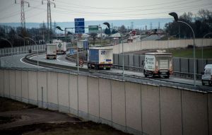A photo taken on February 2, 2017 in Calais, shows a four-metre-high (13-foot) wall, running along a kilometre-long stretch of the main road leading to Calais port, aimed at stopping migrants who attempt to reach its shores. The wall was built to boost a network of wire fences that had failed to prevent near nightly attempts by migrants to waylay trucks en route to Europe's second-busiest port. Calais has for years been a staging post for attempts by migrants to sneak into Britain by stowing away on trucks or trains crossing the Channel. / AFP / PHILIPPE HUGUEN (Photo credit should read PHILIPPE HUGUEN/AFP/Getty Images)