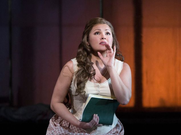 Tatiana (Anna Netrebko) composes her fateful love letter in 'Eugene Onegin'.