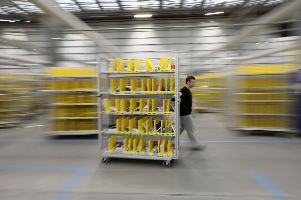 PETERBOROUGH, ENGLAND - NOVEMBER 15: Parcels are processed and prepared for dispatch at Amazon's fulfillment centre on November 15, 2016 in Peterborough, England. In the lead up to Christmas, Amazon is experiencing the busiest time of the year. (Photo by Dan Kitwood/Getty Images)