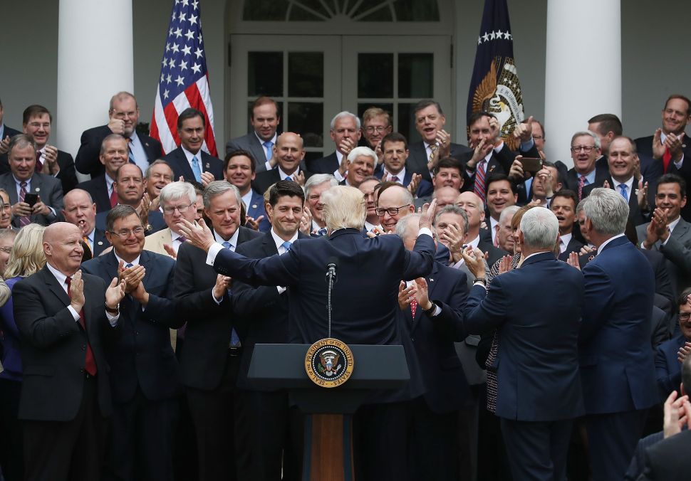 President Donald Trump congratulates House Republicans after they passed legislation aimed at repealing the Affordable Care Act during an event at the White House on May 4, 2017.