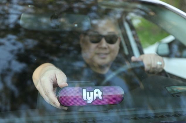 SAN FRANCISCO, CA - JANUARY 31: A Lyft driver places the Amp on his dashboard on January 31, 2017 in San Francisco, California. (Photo by Kelly Sullivan/Getty Images for Lyft)