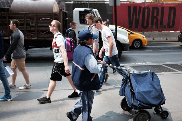 NEW YORK, NY - JUNE 05: A Postal Service worker is viewed in lower Manhattan on June 5, 2015 in New York City. New numbers which were released by the government today showed that the U.S. economy gained 280,000 jobs in May and over a million new jobs so far in 2015. May's jobs report dispelled fears that the U.S. economy was contracting after the winter slowdown. (Photo by Spencer Platt/Getty Images)