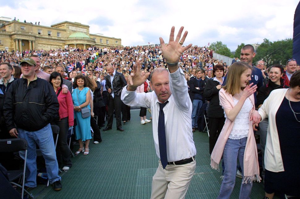 LONDON, UNITED KINGDOM: People dance in the aisles during "Party at the Palace" in London 03 June 2002. As part of Queen Elizabeth's Golden Jubilee celebrations 12,000 people watched a pop concert in the garden of Buckingham Palace to celebrate Queen Elizabeth's 50 years on the throne. AFP PHOTO Adrian DENNIS / WPA POOL (Photo credit should read ADRIAN DENNIS/AFP/Getty Images)