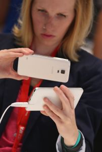 BERLIN, GERMANY - SEPTEMBER 03: A visitor looks at a Galaxy Note 5 smartphone at the Samsung stand during a press day at the 2015 IFA consumer electronics and appliances trade fair on September 3, 2015 in Berlin, Germany. The 2015 IFA will be open to the public from September 4-9. (Photo by Sean Gallup/Getty Images)