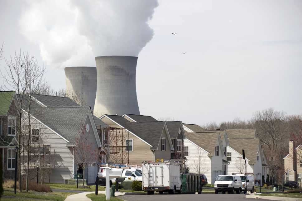 Cooling towers from the Limerick Generating Station, a nuclear power plant in Pottstown, Pennsylvania, are seen from a nearby neighborhood March 25, 2011. Limerick consists of two boiling water reactors designed by General Electric and is located on the Schuylkill River.