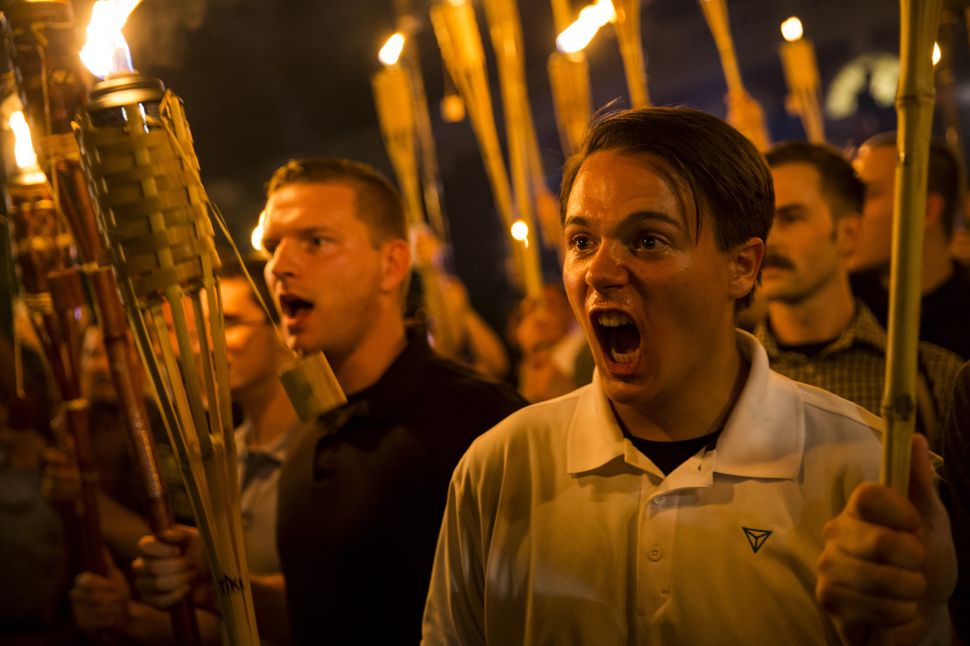 Neo Nazis, Alt-Right, and White Supremacists encircle and chant at counter protestors at the base of a Thomas Jefferson statue after marching through the University of Virginia campus in Charlottesville, Virginia on August 11.