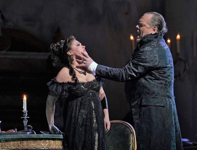 Anna Netrebko as Tosca is about to turn the tables on Scarpia (Michael Volle).
