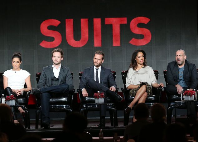 PASADENA, CA - JANUARY 18: (L-R) Executive producer Aaron Korsh, actress Meghan Markle, actor Patrick J. Adams, actor Gabriel Macht, actress Gina Torres, actor Rick Hoffman, and actress Sarah Rafferty of the television show "Suits" speak during the NBC Universal portion of the 2014 Winter Television Critics Association Press Tour at the Langham Hotel on January 18, 2014 in Pasadena, California. (Photo by Frederick M. Brown/Getty Images)