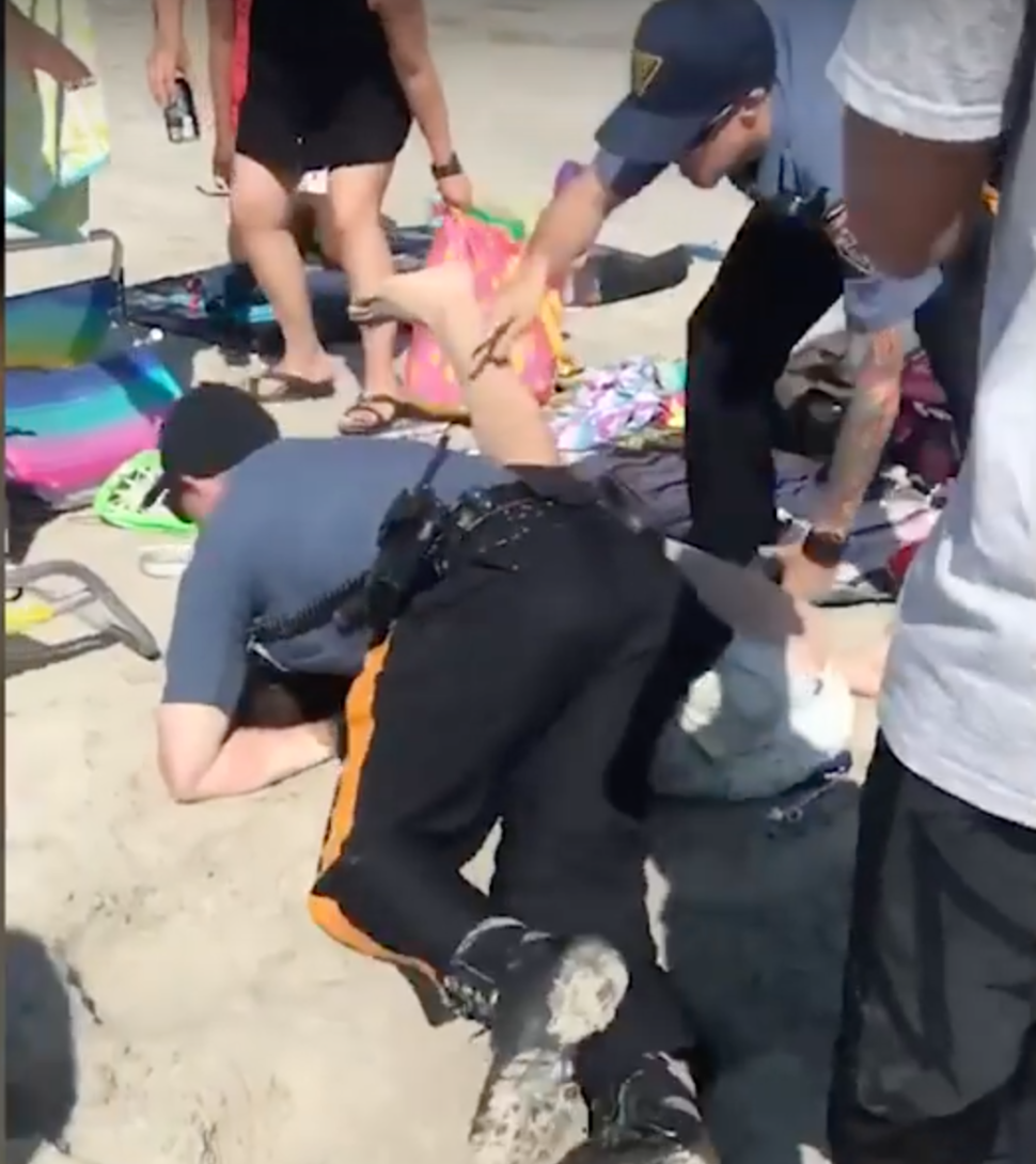 Cop Punches Woman on Beach Video