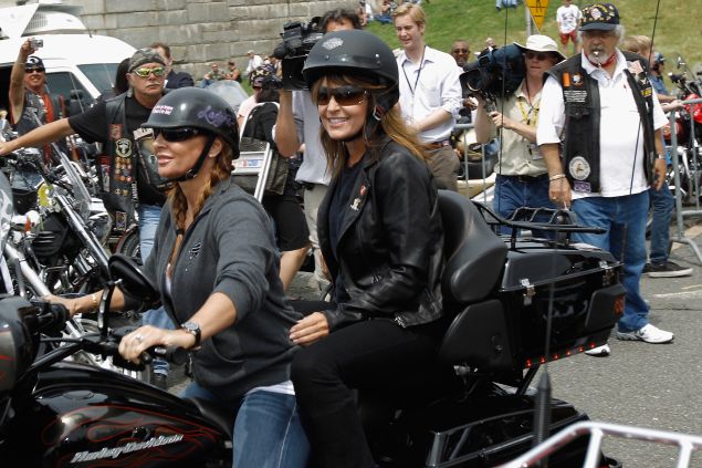 Sarah Palin rides on the back of a Harley-Davidson before the "Rolling Thunder" in Arlington, Virginia.