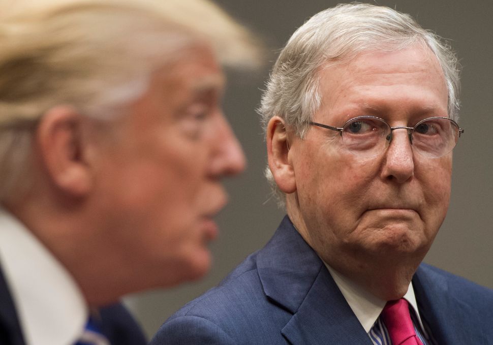 US President Donald Trump speaks alongside Senate Majority Leader Mitch McConnell (R), as they hold a meeting about tax reform in the Roosevelt Room of the White House in Washington, DC, September 5, 2017.