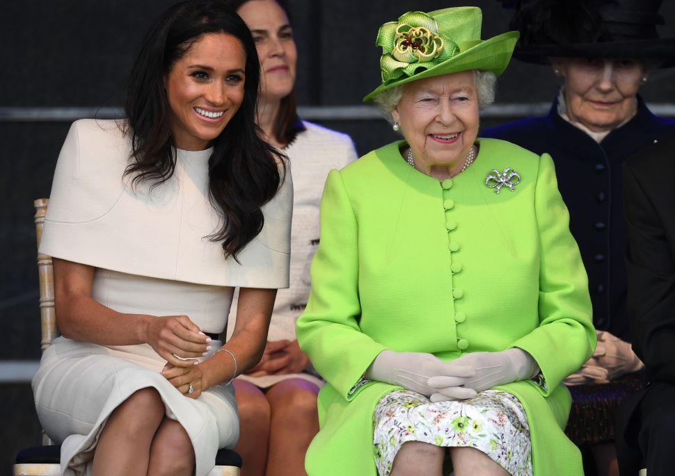 WIDNES, ENGLAND - JUNE 14: Queen Elizabeth II sits with Meghan, Duchess of Sussex during a ceremony to open the new Mersey Gateway Bridge on June 14, 2018 in the town of Widnes in Halton, Cheshire, England. Meghan Markle married Prince Harry last month to become The Duchess of Sussex and this is her first engagement with the Queen. During the visit the pair will open a road bridge in Widnes and visit The Storyhouse and Town Hall in Chester.