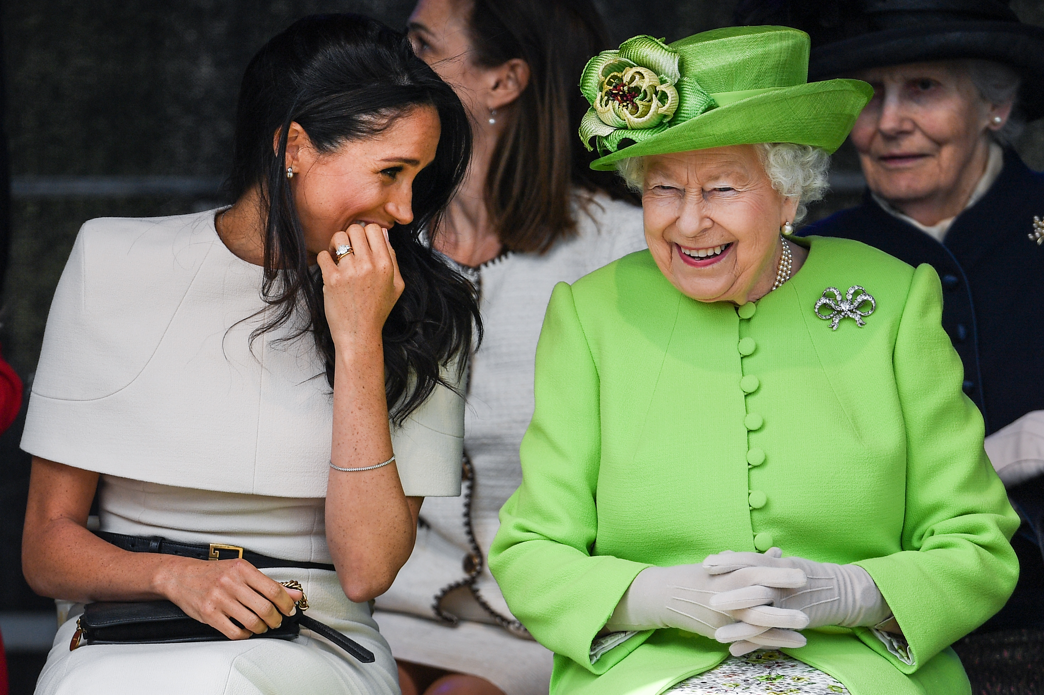 CHESTER, ENGLAND - JUNE 14: Queen Elizabeth II sitts and laughs with Meghan, Duchess of Sussex during a ceremony to open the new Mersey Gateway Bridge on June 14, 2018 in the town of Widnes in Halton, Cheshire, England. Meghan Markle married Prince Harry last month to become The Duchess of Sussex and this is her first engagement with the Queen. During the visit the pair will open a road bridge in Widnes and visit The Storyhouse and Town Hall in Chester.