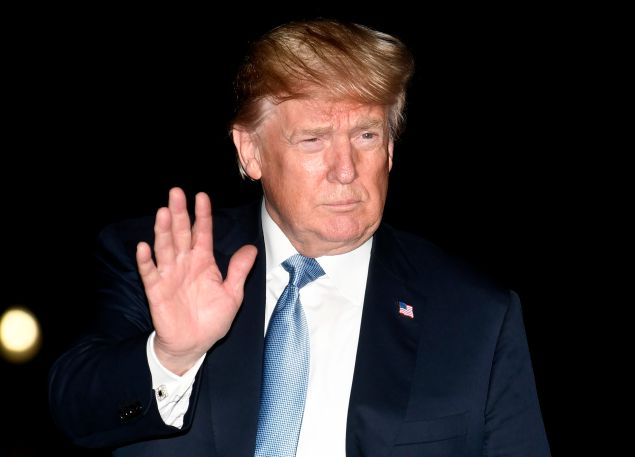 President Donald Trump waves to the press on his arrival at the White House, June 23, 2018 in Washington, DC. Trump met with supporters and delivered remarks to the Nevada Republican Party Convention.