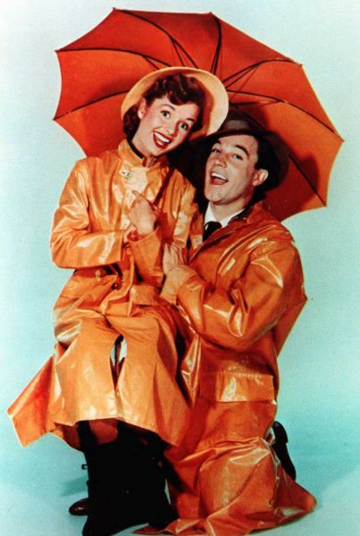 Gene Kelly and Debbie Reynolds pose for the poster of Singin' In the Rain.