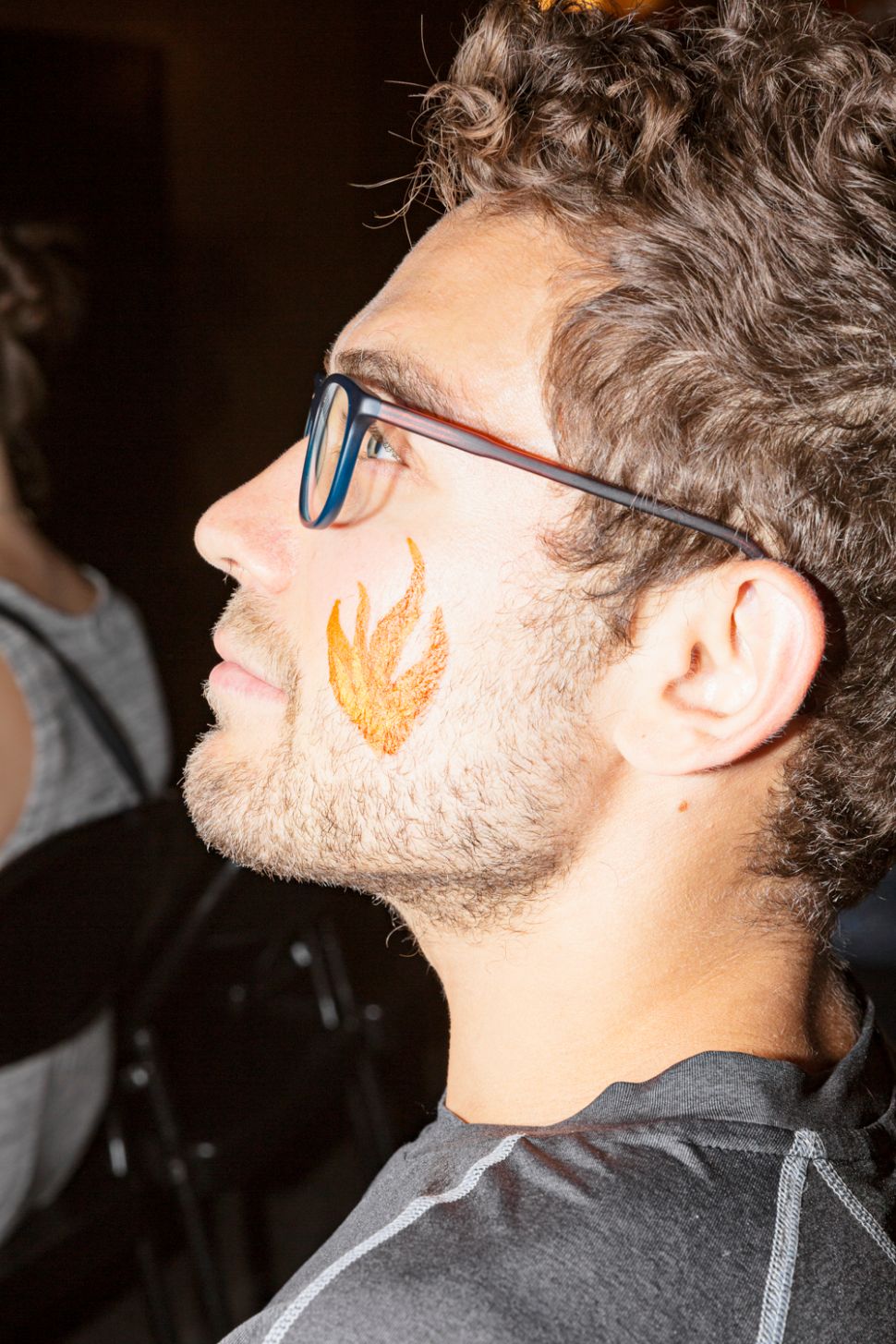 The author with a fire emoji face painting