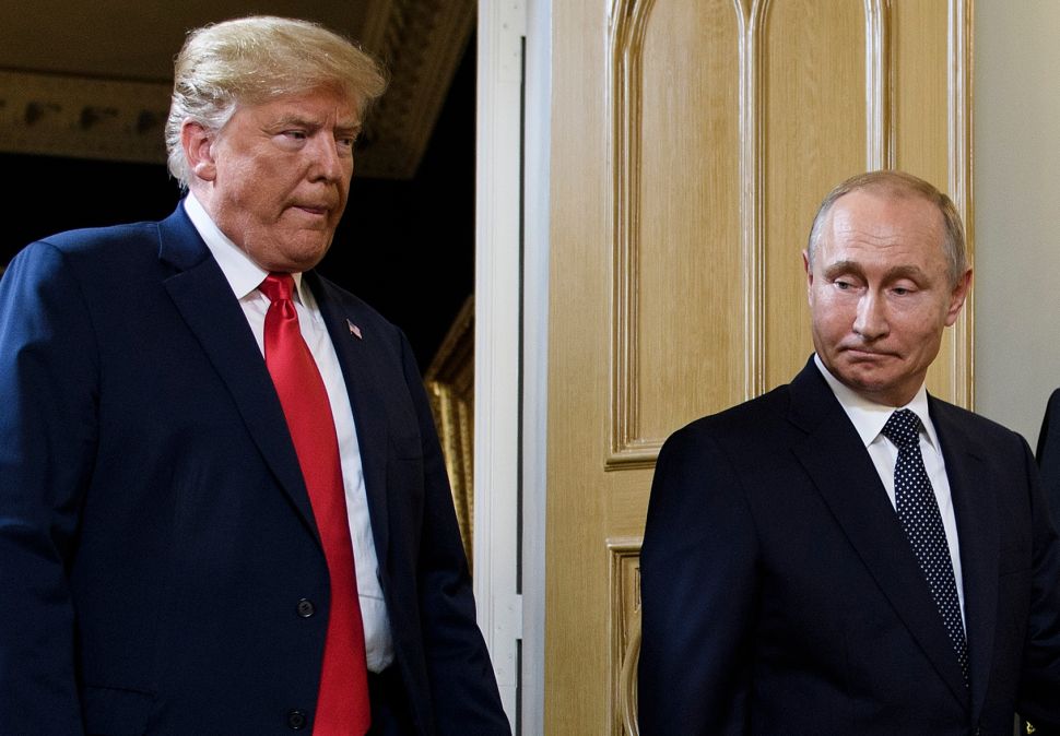US President Donald Trump (L) and Russian President Vladimir Putin arrive for a meeting in Helsinki, on July 16, 2018. (Photo by Brendan Smialowski / AFP) (Photo credit should read BRENDAN SMIALOWSKI/AFP/Getty Images)