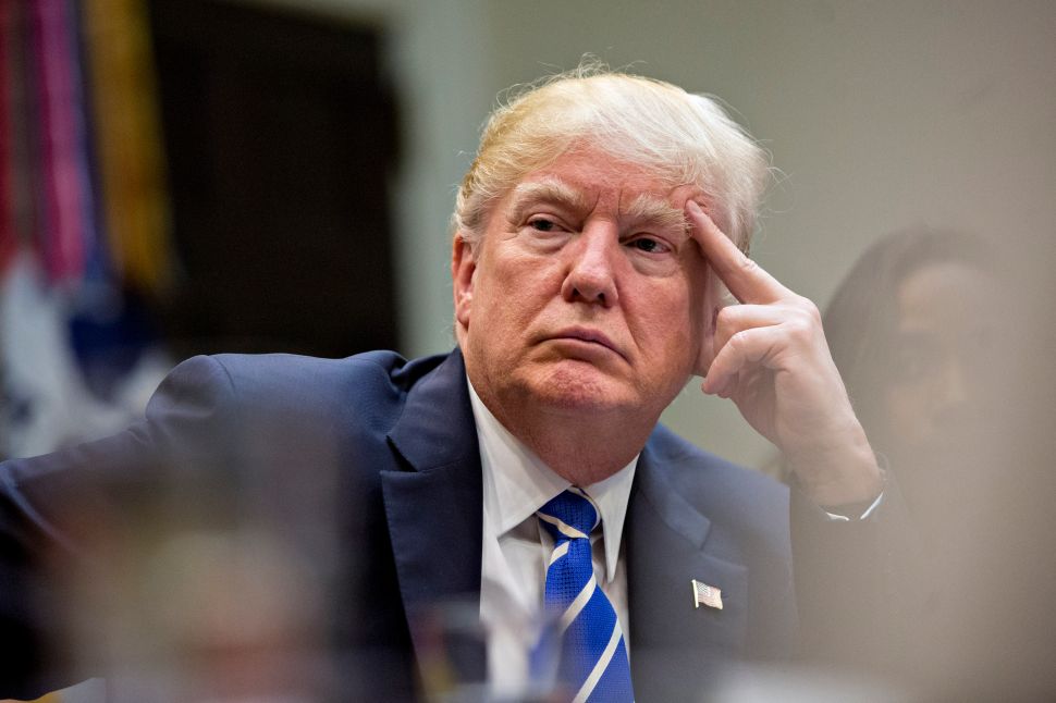 WASHINGTON, DC - MARCH 27: U.S. President Donald Trump listens while meeting with women small business owners in the Roosevelt Room of the White House on March 27, 2017 in Washington, D.C. Investors on Monday further unwound trades initiated in November resting on the idea that the election of Trump and a Republican Congress meant smooth passage of an agenda that featured business-friendly tax cuts and regulatory changes. (Photo by Andrew Harrer-Pool/Getty Images)