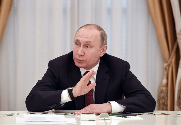 Russian President Vladimir Putin meets with other candidates in the poll, a day after the presidential election, at the Kremlin in Moscow on March 19, 2018.