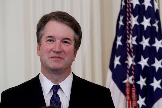 U.S. Circuit Judge Brett M. Kavanaugh looks on as U.S. President Donald Trump introduces him as his nominee to the United States Supreme Court during an event in the East Room of the White House July 9, 2018 in Washington, DC. Pending confirmation by the U.S. Senate, Judge Kavanaugh would succeed Associate Justice Anthony Kennedy, 81, who is retiring after 30 years of service on the high court.