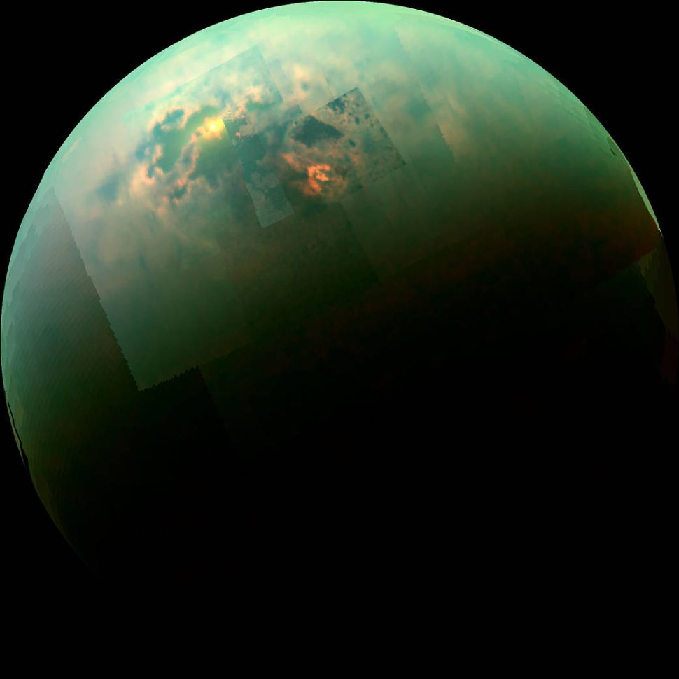 This near-infrared, color mosaic from NASA's Cassini spacecraft shows the sun glinting off of Titan's north polar seas.