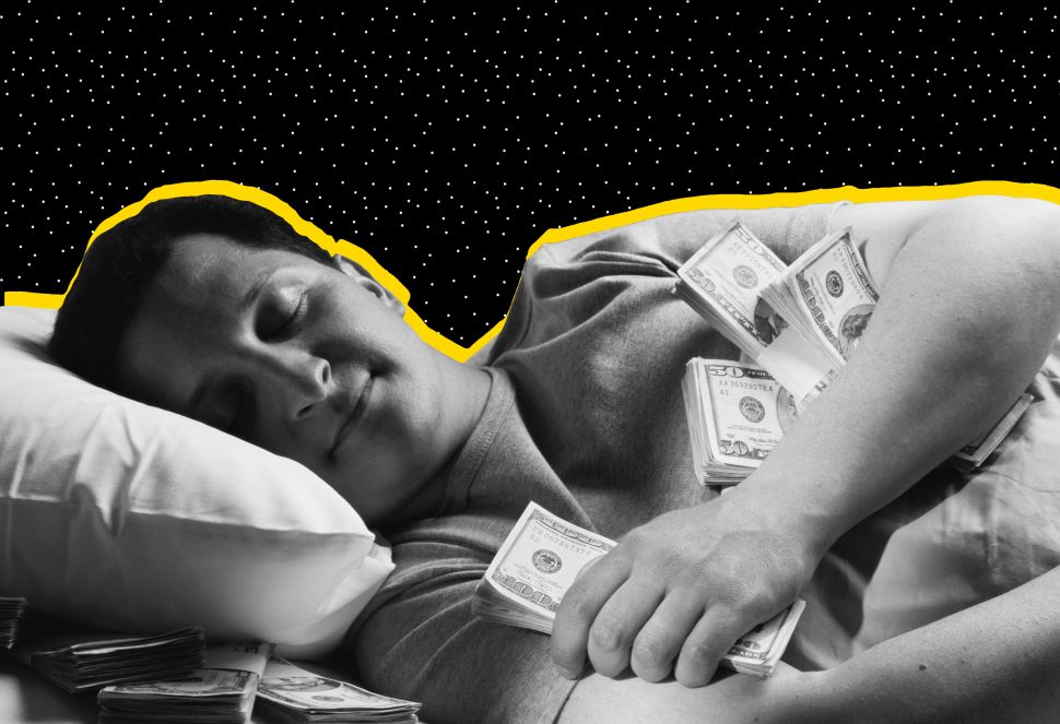 A man sleeping on a bed filled with money