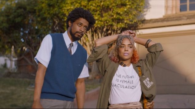 Tessa Thompson as Detroit wearing a shirt that reads 'The Future is Female Ejaculation.'