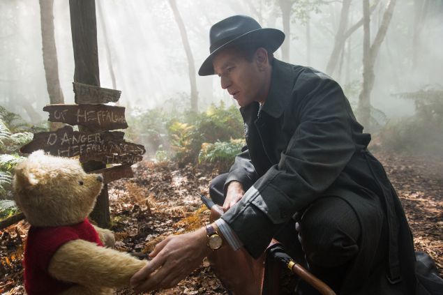 Ewan McGregor as Christopher Robin with Winnie the Pooh, voiced by Jim Cummings.
