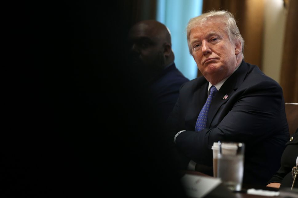WASHINGTON, DC - AUGUST 01: (AFP OUT) U.S. President Donald Trump listens during a meeting with inner city pastors in the Cabinet Room of the White House on August 1, 2018 in Washington, DC. (Photo by )