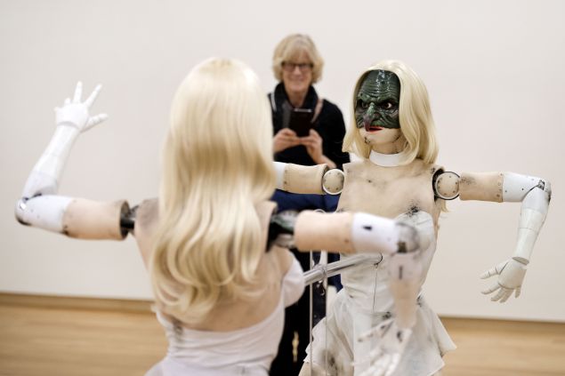 A woman looks at Female figure, an animatronic sculpture of a woman by US artist Jordan Wolfson, at the Stedelijk Museum in 2017.