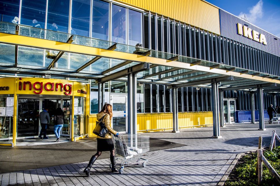 People walk outside a store of Swedish furniture giant Ikea in Delft, the Netherlands.