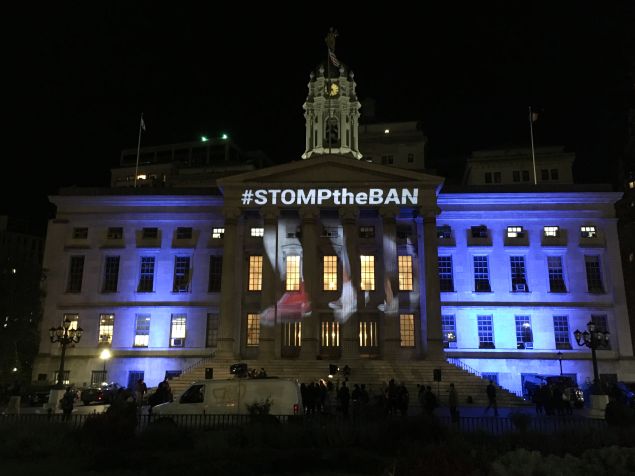 The Illuminator projects 'Stomp the Ban' on the Brooklyn's City Hall.