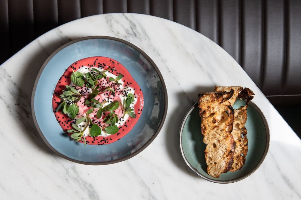 Simone's burrata with plum confit, nigella, purslane and Mint, one of the menu items from James Beard Award winner Jessica Largey.