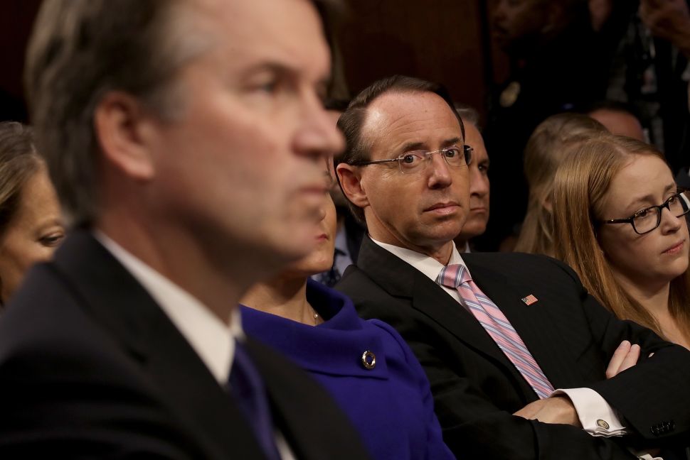 Deputy Attorney General Rod Rosenstein listens as Supreme Court nominee Judge Brett Kavanaugh appears before the Senate Judiciary Committee.