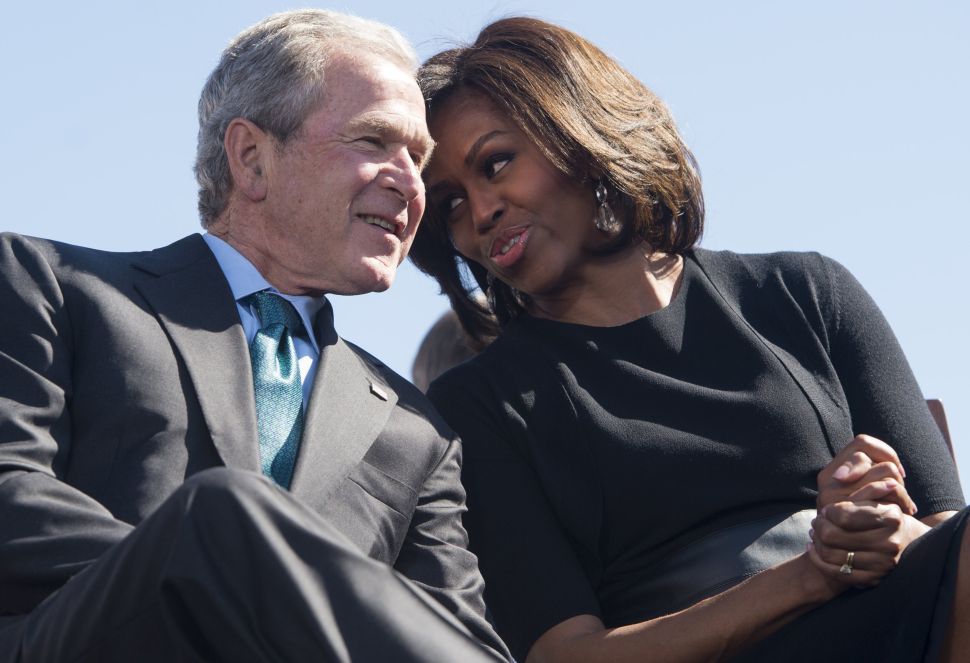 George W. Bush and Michelle Obama's candy hand-off went viral. If only someone besides noted scammer Roland Scahill tweeted it out.