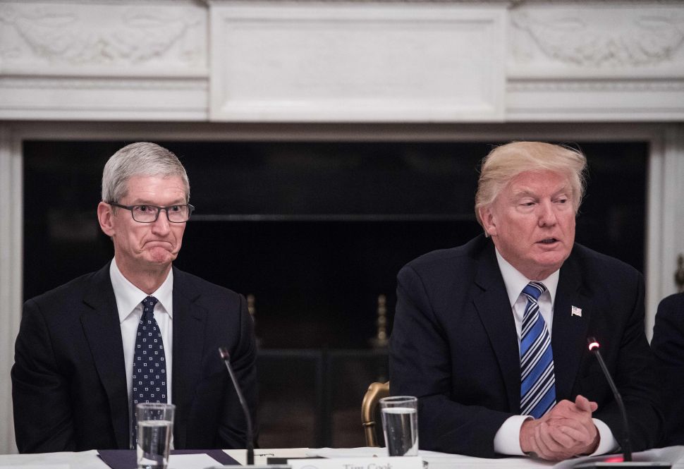 Apple CEO Tim Cook had dinner with President Trump one month before Apple's product launch.