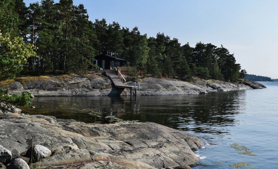 A dock leads to the water, from one of SuperShe Island's guest cabins.