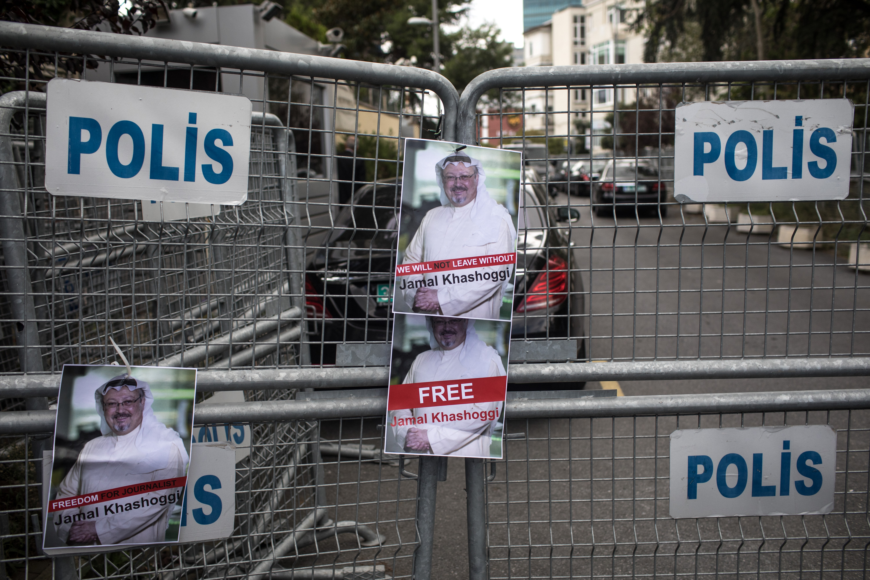Posters of missing Saudi journalist Jamal Khashoggi stuck to a police barricade outside Saudi Arabia's consulate in Istanbul, Turkey.