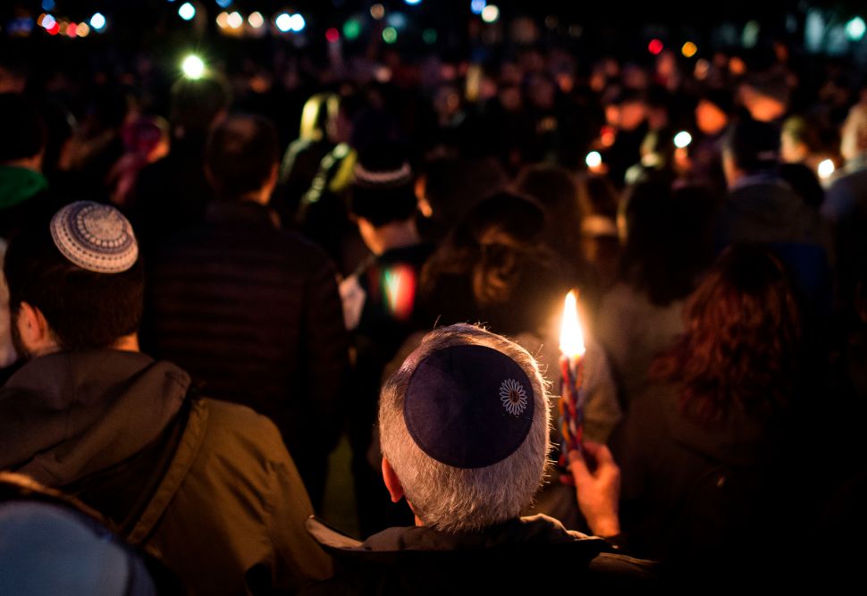 Members and supporters of the Jewish community come together for a candlelight vigil, in remembrance of those who died on Saturday during a shooting at the Tree of Life Synagogue in Pittsburgh.