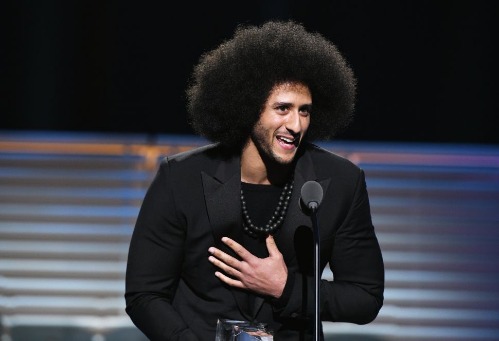 Colin Kaepernick receives the SPORTS ILLUSTRATED Muhammad Ali Legacy Award.