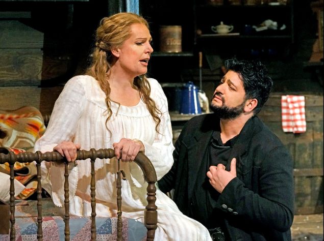 Minnie (Eva-Maria Westbroek) gets acquainted with the mysterious Mr. Johnson (Yusif Eyvazov) in 'La fanciulla del West'.