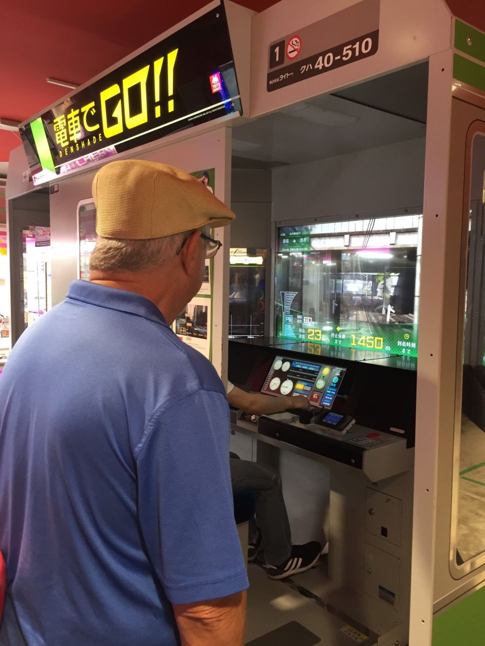 The author's stepfather marvels over a game cabinet's design.